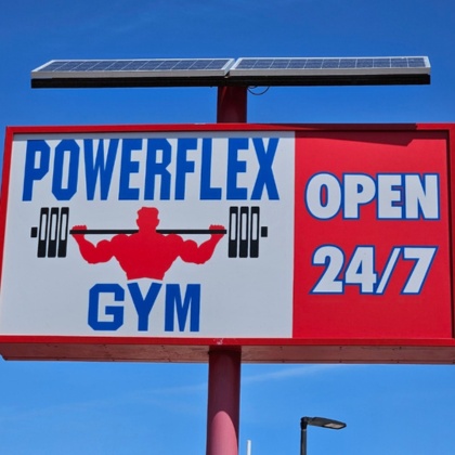 a sign for powerflex gym in albuquerque stating it is open 247